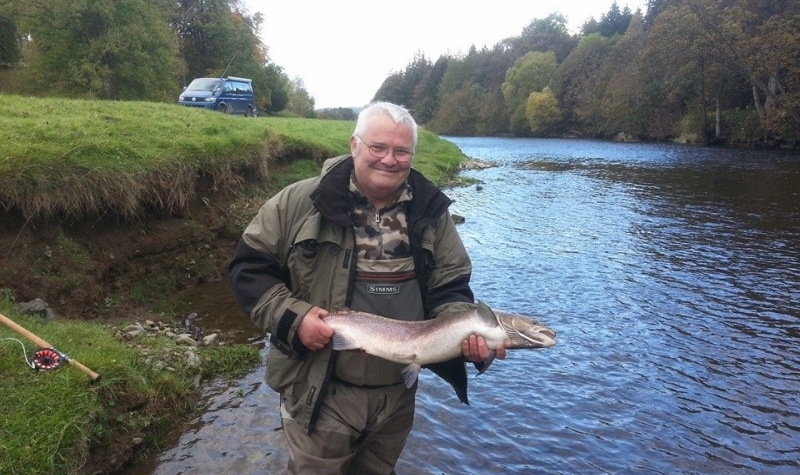 Client with salmon, River Tweed Client with salmon, River Tweed